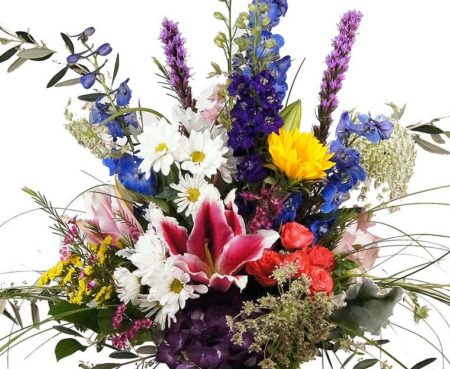 Hydrangea, Lilies and delphinium are just a few of the flowers in this stunning arrangement, that is sure to convey your feelings!