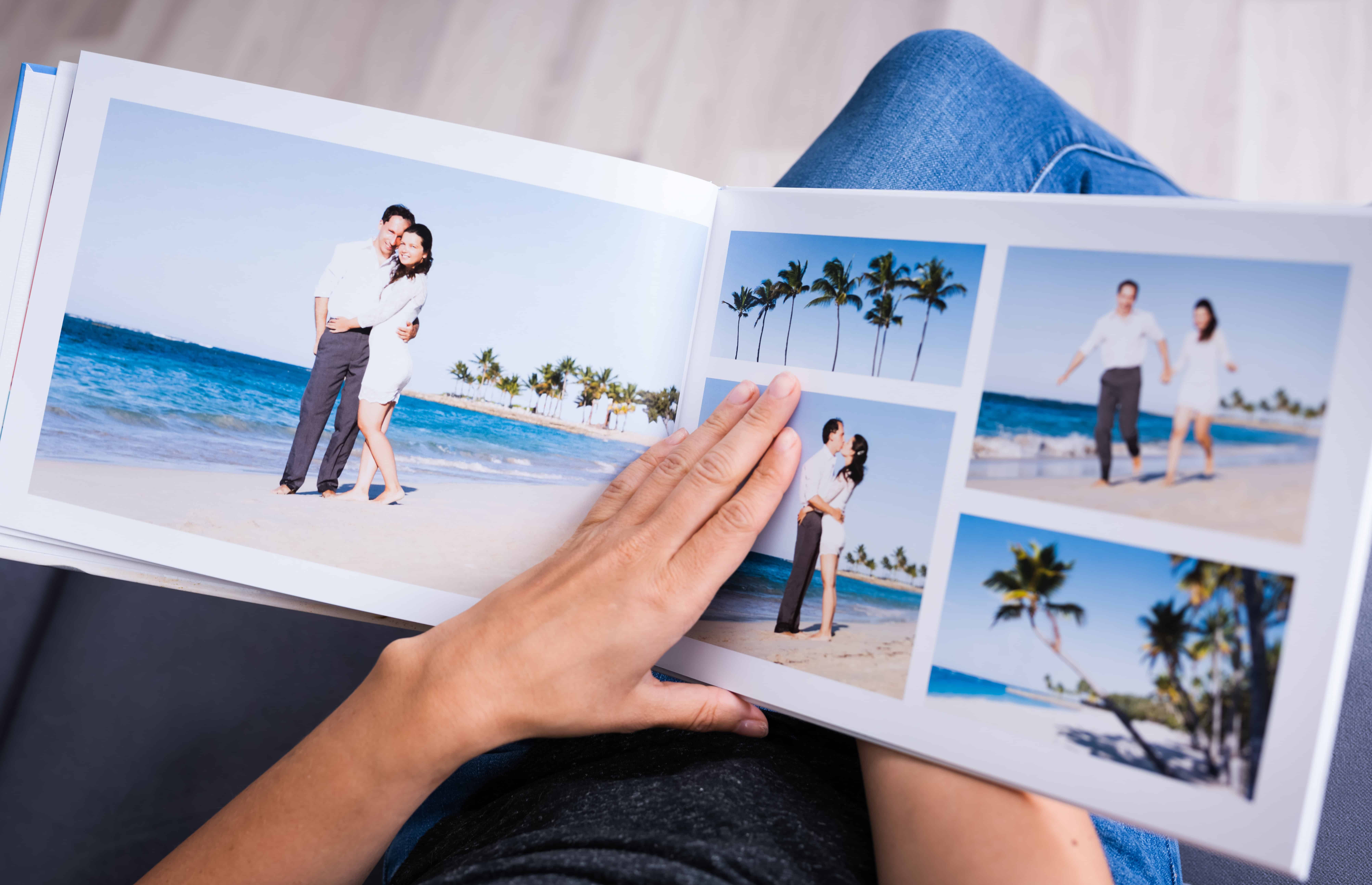 open photo book with pictures of beach