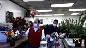 Steve and Joe Neubauer showcase colorful Valentine's Day rose bouquets.